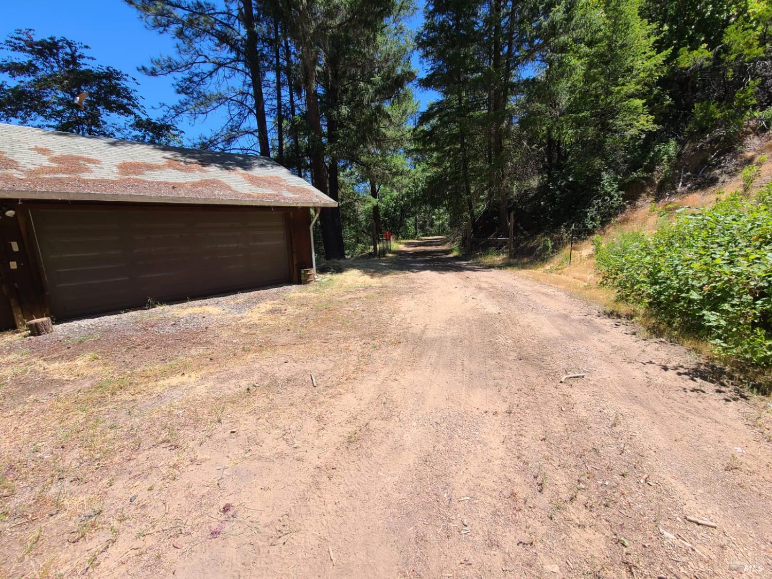 3620 Eel River Ranch Road Covelo, CA 95428 - Photo 22 of 27 a front view of a house with a yard