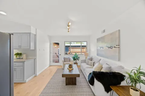 a living room with furniture and window