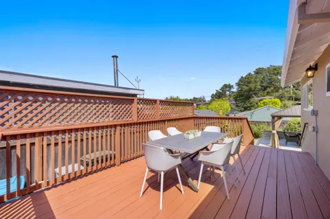 a view of a chairs on wooden deck