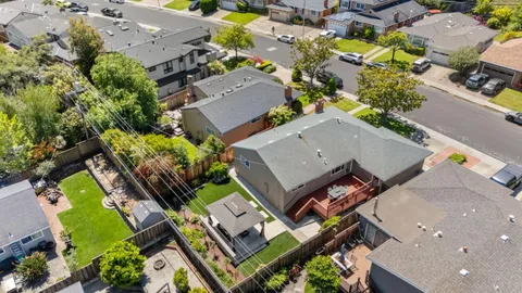 an aerial view of a house with a swimming pool