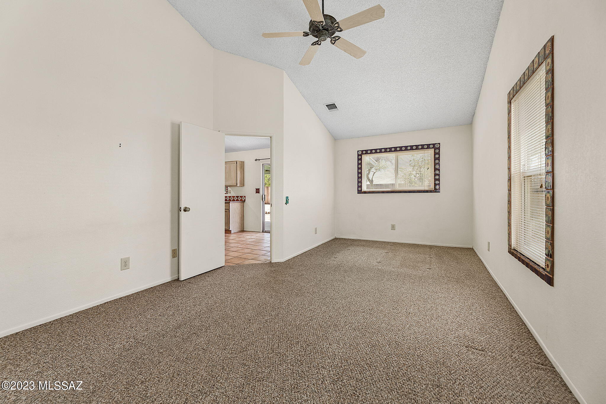 10610 Keystone Road East Tucson, AZ 85730 - Photo 19 of 35 a view of an empty room with a window