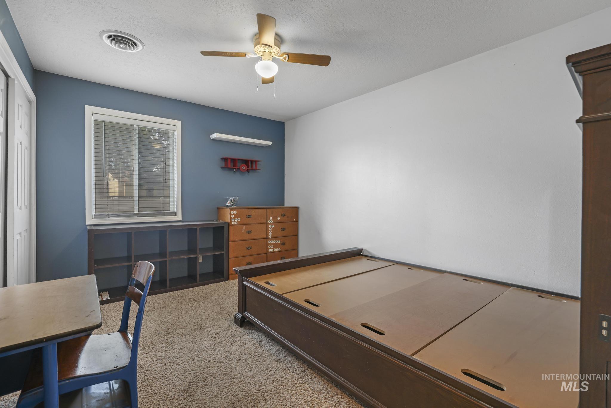 721 Beta Circle Twin Falls, ID 83301 - Photo 21 of 28 Carpeted bedroom featuring a ceiling fan