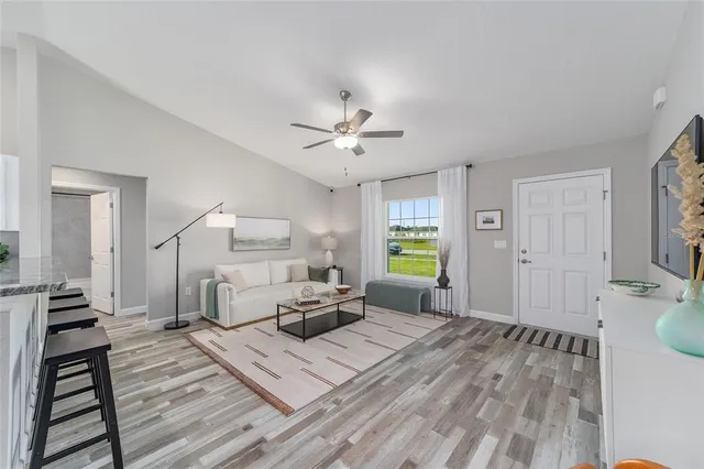 a living room with furniture and a window