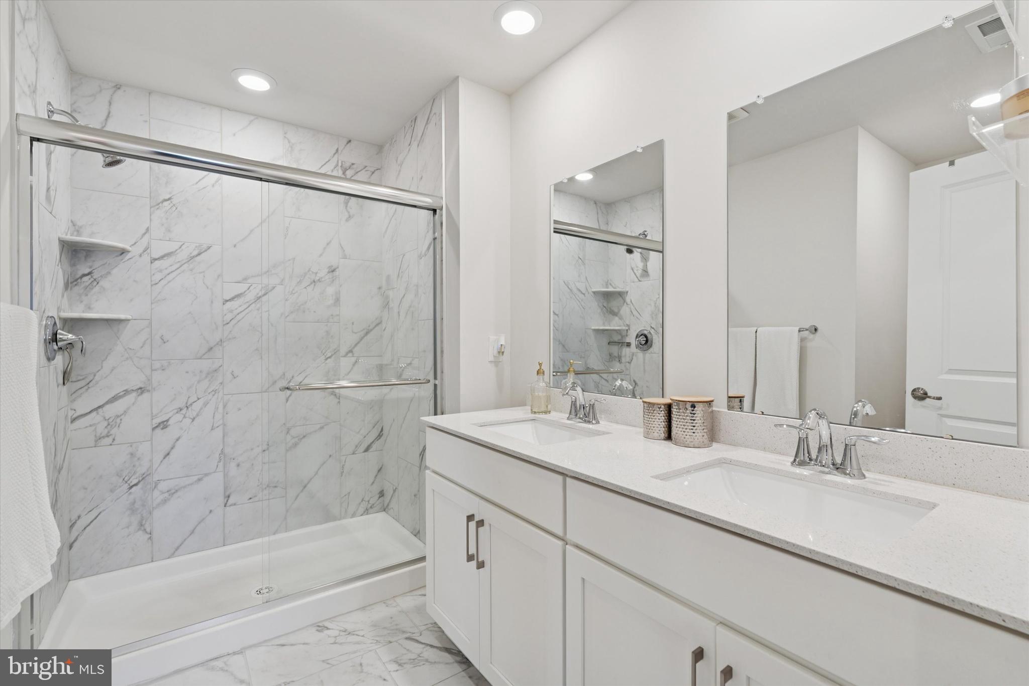 784 Ore Street Phoenixville, PA 19460 - Photo 16 of 30 a bathroom with a shower sink and mirror