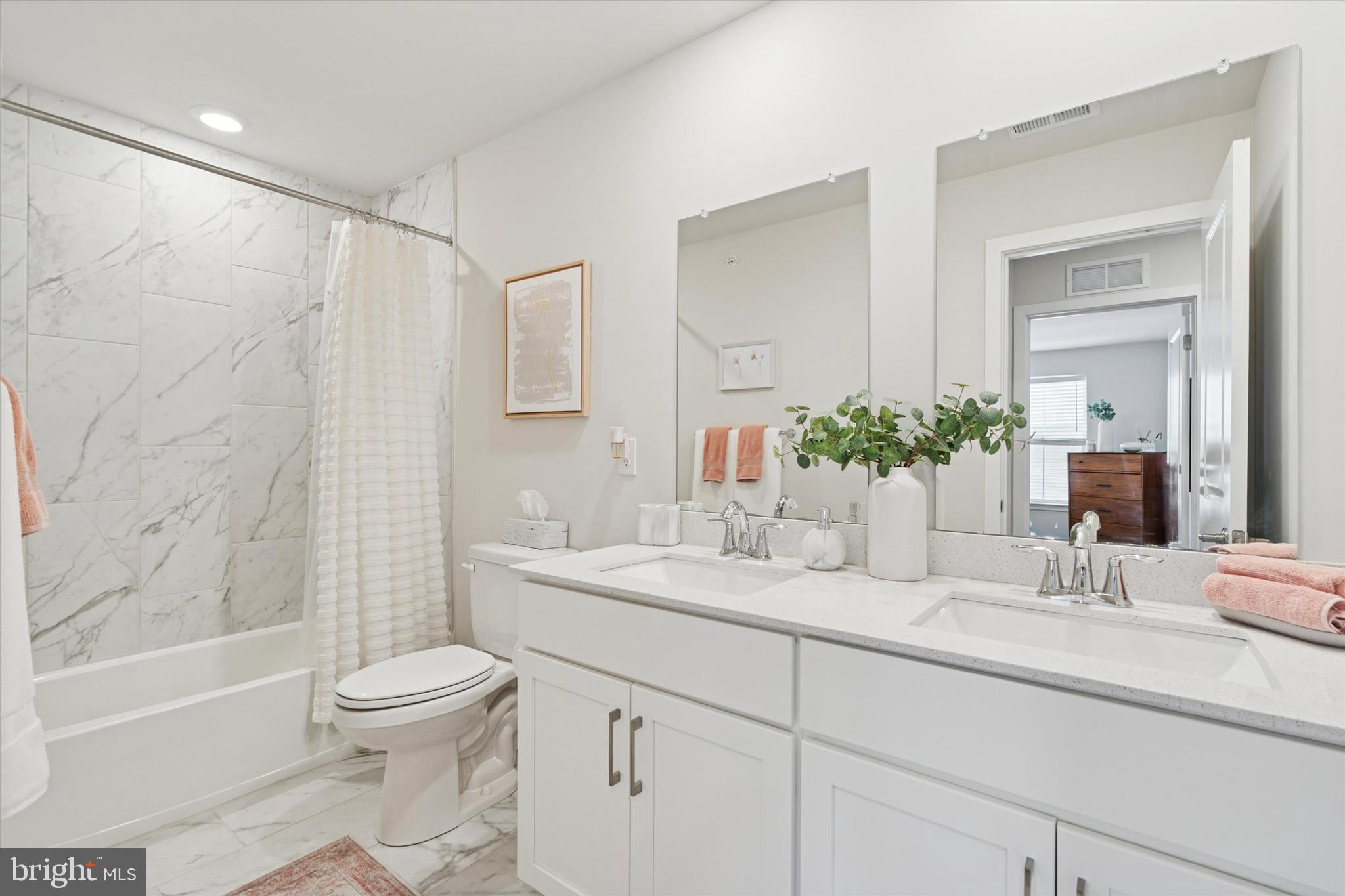 784 Ore Street Phoenixville, PA 19460 - Photo 21 of 30 a bathroom with a granite countertop sink a toilet and shower