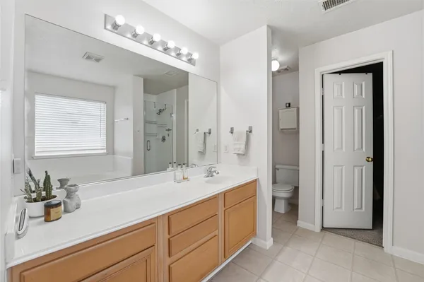 a bathroom with a sink double vanity and a mirror