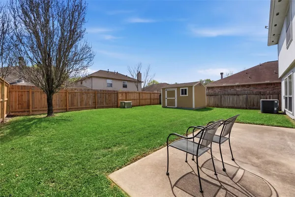 a view of a house with a yard porch and sitting area