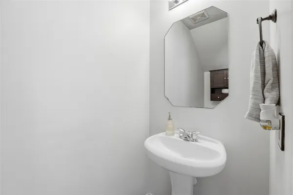 a bathroom with a sink and mirror