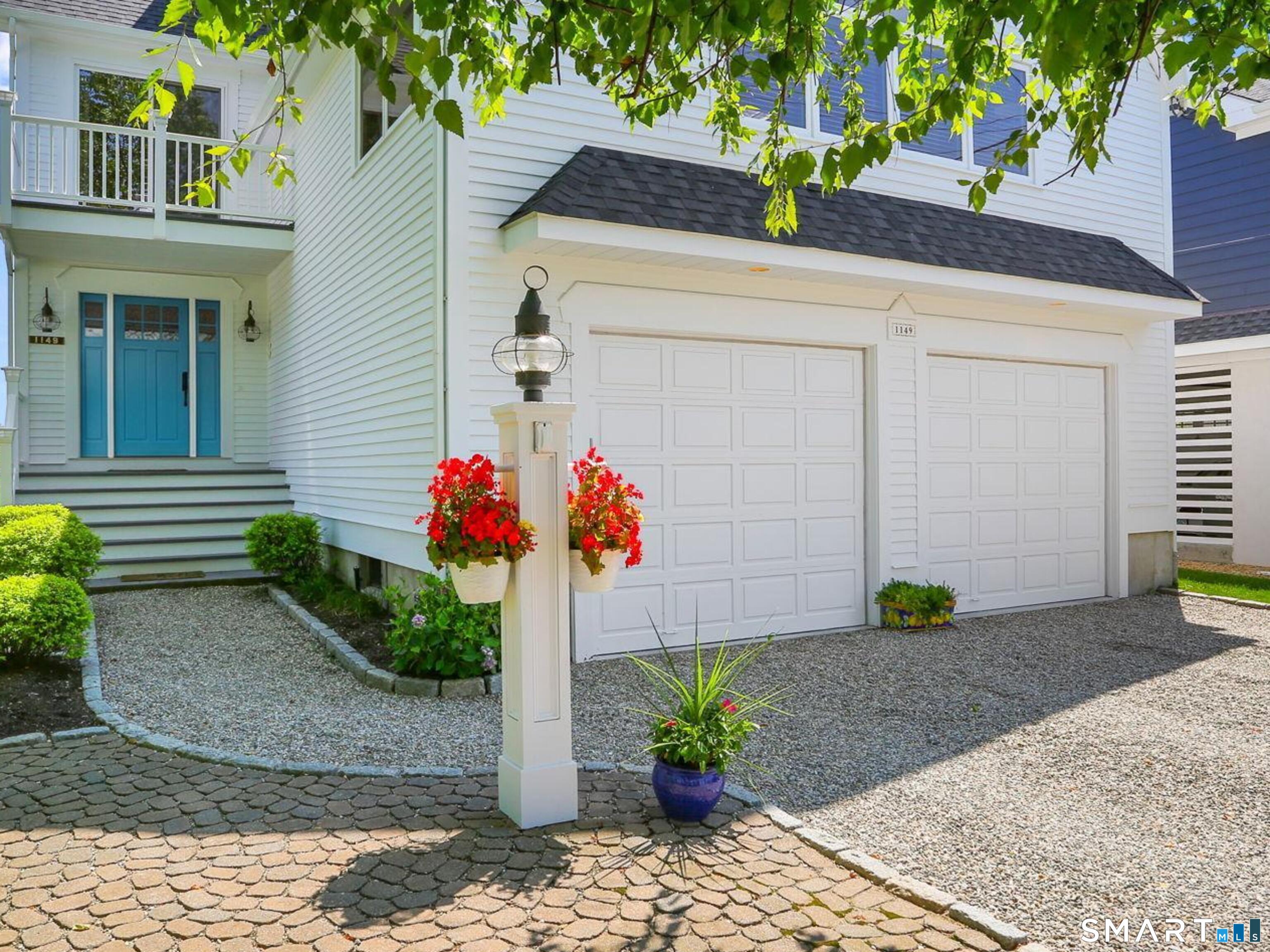 1149 Fairfield Beach Road Fairfield, CT 06824 - Photo 5 of 40 Be greeted by your pretty entry w/ gravel driveway and fun beachy blue door. Entry offers coverage and protection from the weather for package delivery