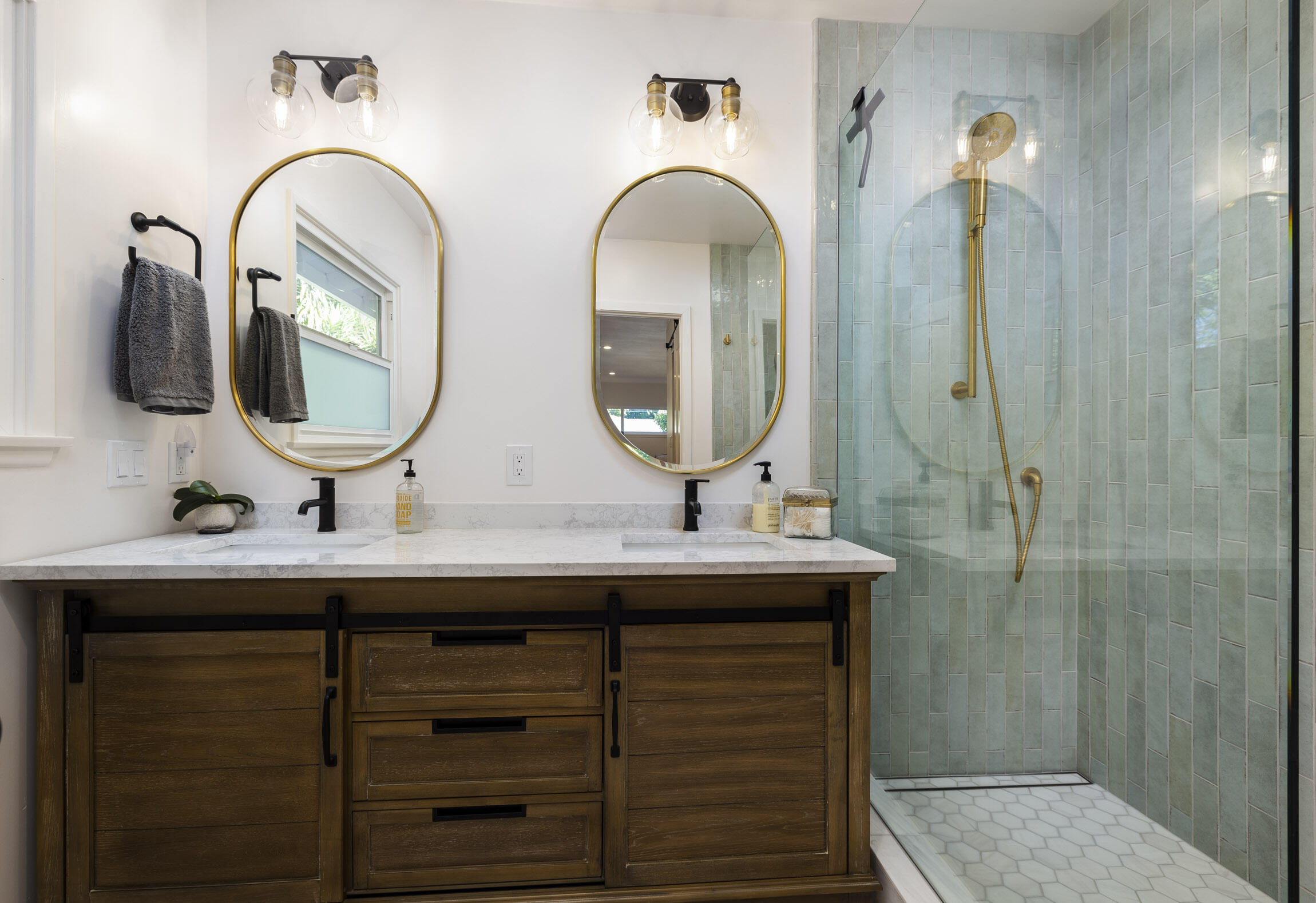 959 Barcelona Drive Santa Barbara, CA 93105 - Photo 20 of 24 a bathroom with a double vanity sink and a mirror