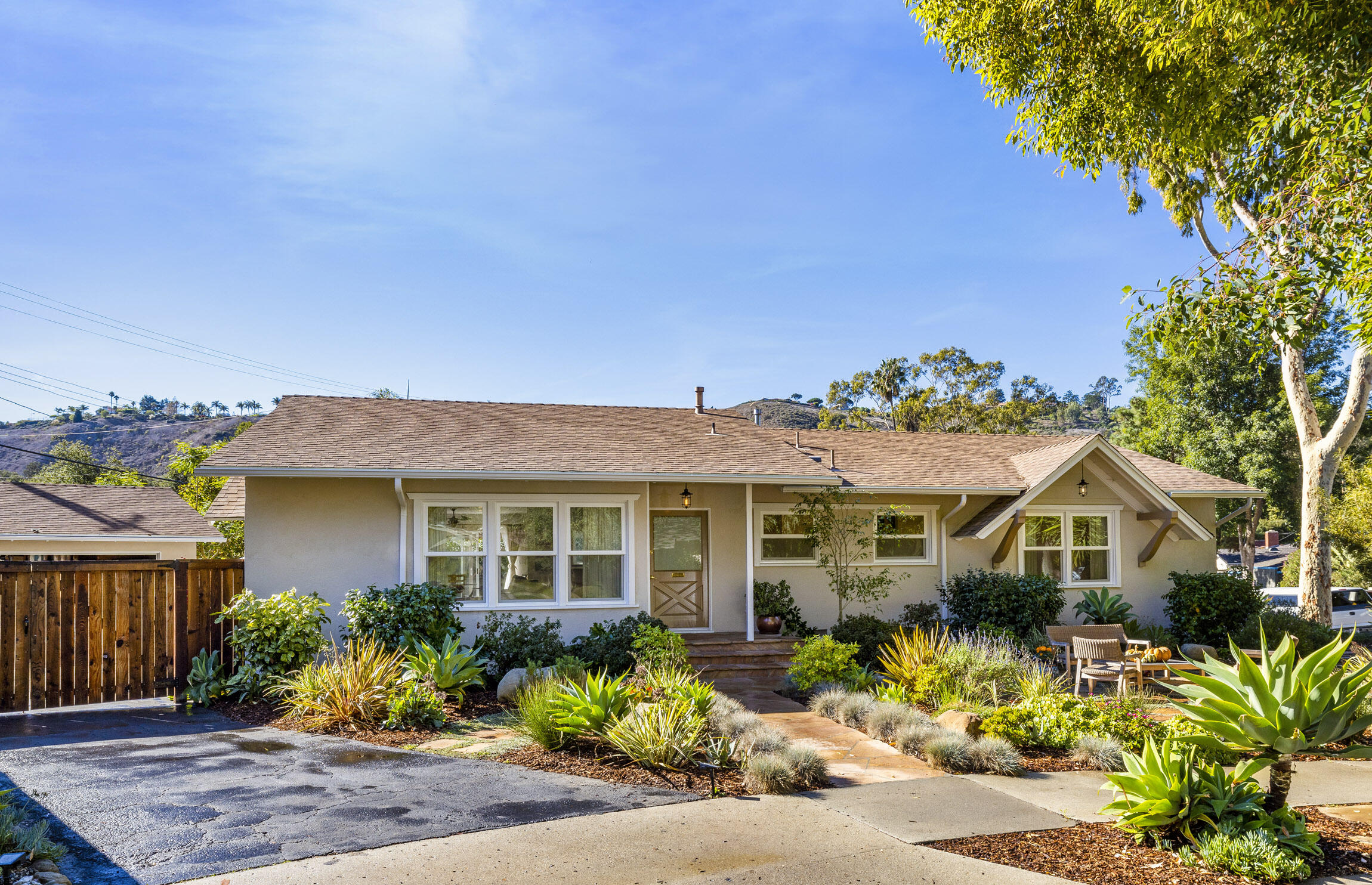 959 Barcelona Drive Santa Barbara, CA 93105 - Photo 6 of 24 a front view of a house with a yard and potted plants