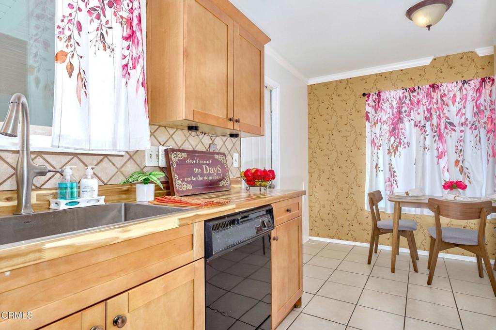 4895 Muirwood Court Simi Valley, CA 93063 - Photo 15 of 45 a kitchen with stainless steel appliances a sink and a refrigerator