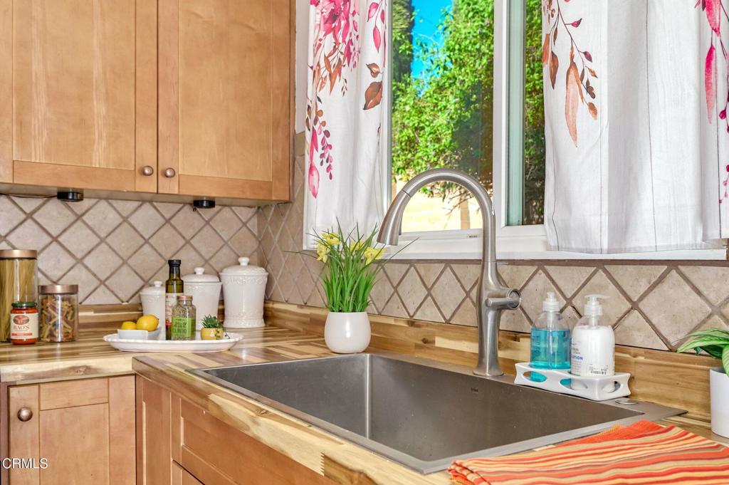 4895 Muirwood Court Simi Valley, CA 93063 - Photo 16 of 45 a kitchen with a sink and a granite counter top