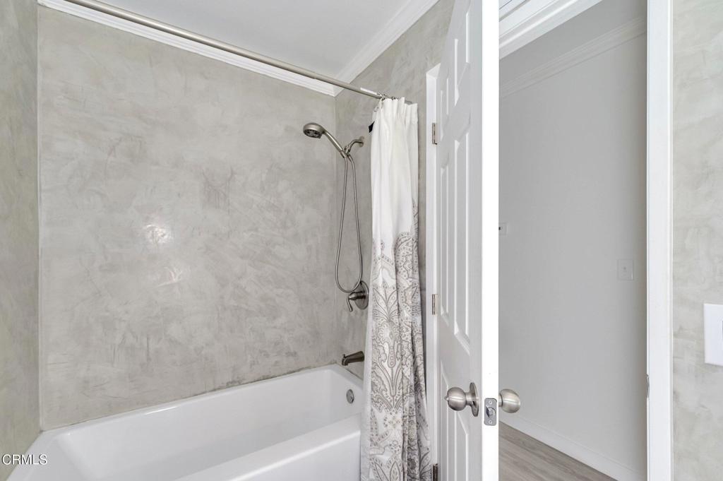 4895 Muirwood Court Simi Valley, CA 93063 - Photo 19 of 45 a bathroom with a shower and a bath tub