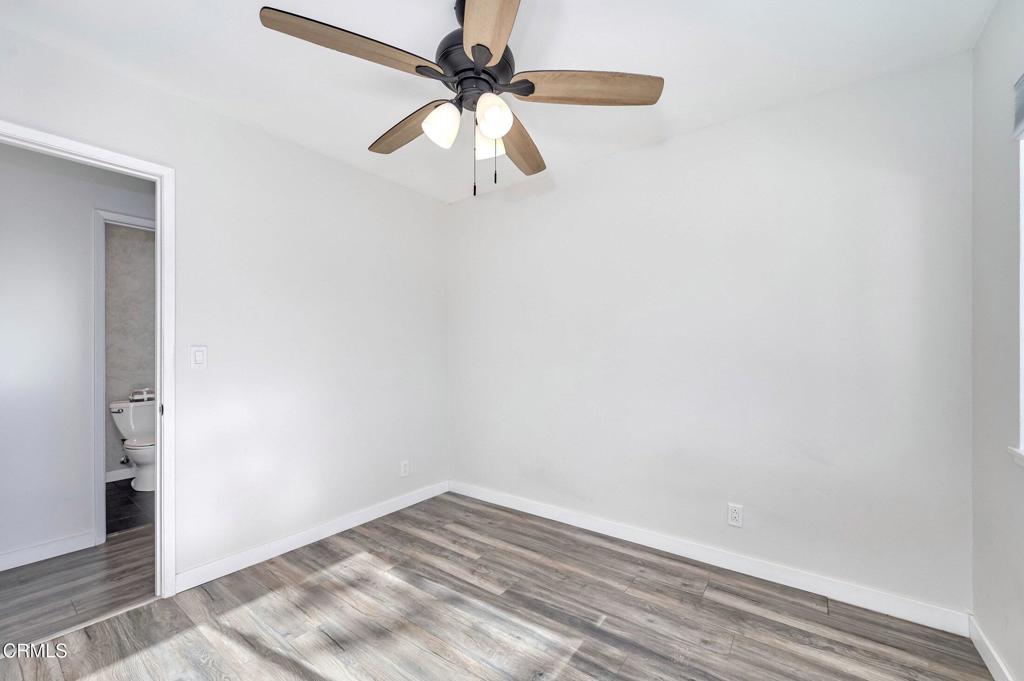 4895 Muirwood Court Simi Valley, CA 93063 - Photo 22 of 45 a view of a room with wooden floor and fan
