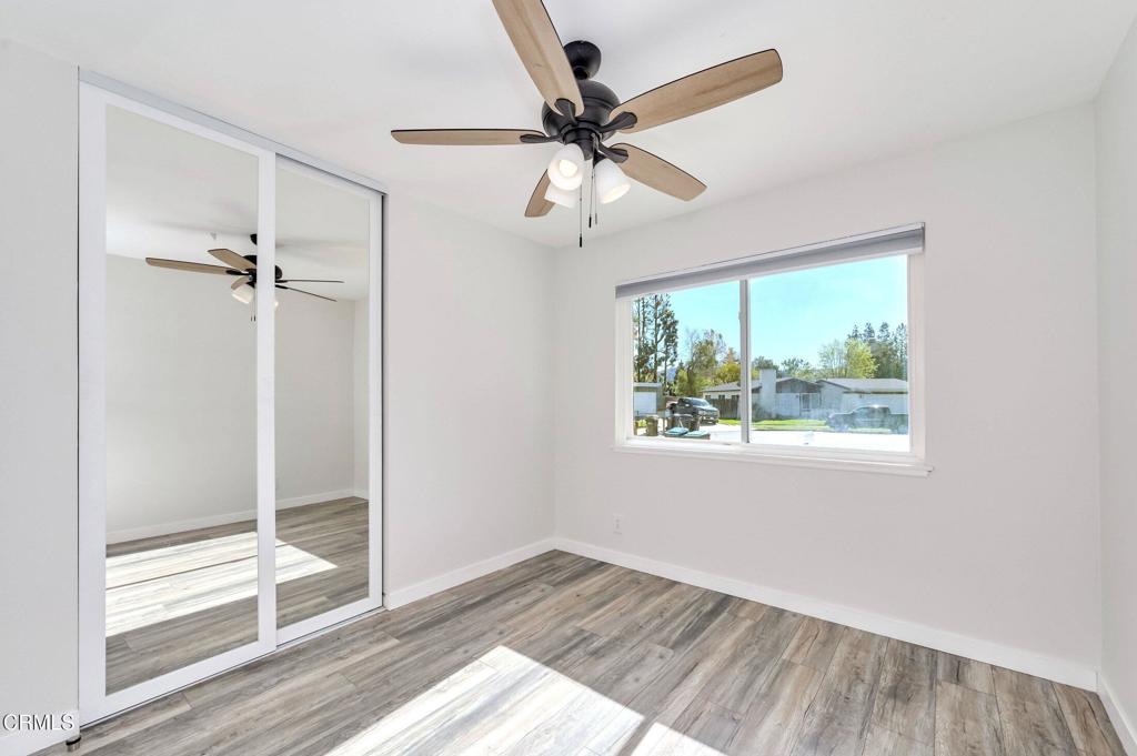 4895 Muirwood Court Simi Valley, CA 93063 - Photo 25 of 45 wooden floor in an empty room with a window