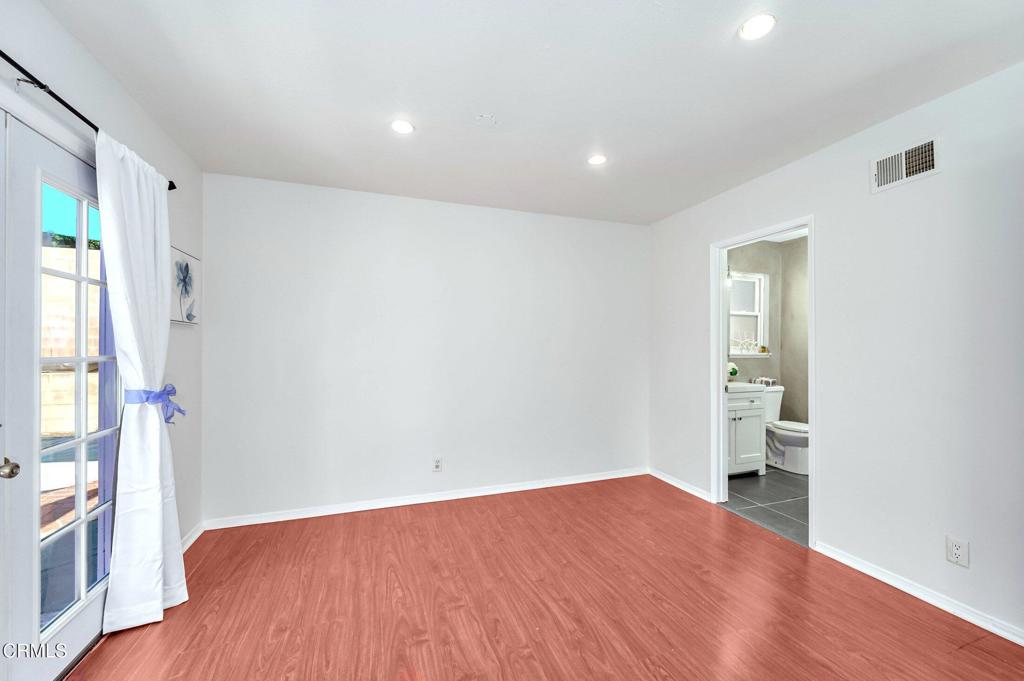 4895 Muirwood Court Simi Valley, CA 93063 - Photo 29 of 45 wooden floor in an empty room with a window