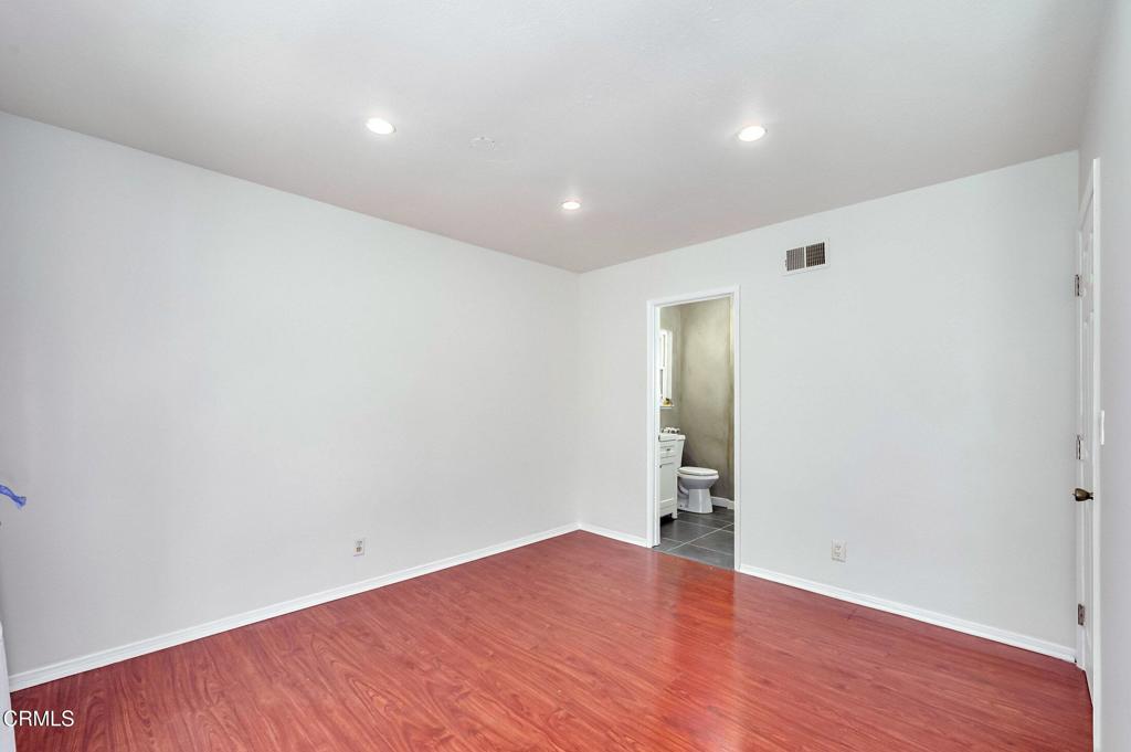 4895 Muirwood Court Simi Valley, CA 93063 - Photo 30 of 45 a view of empty room with wooden floor