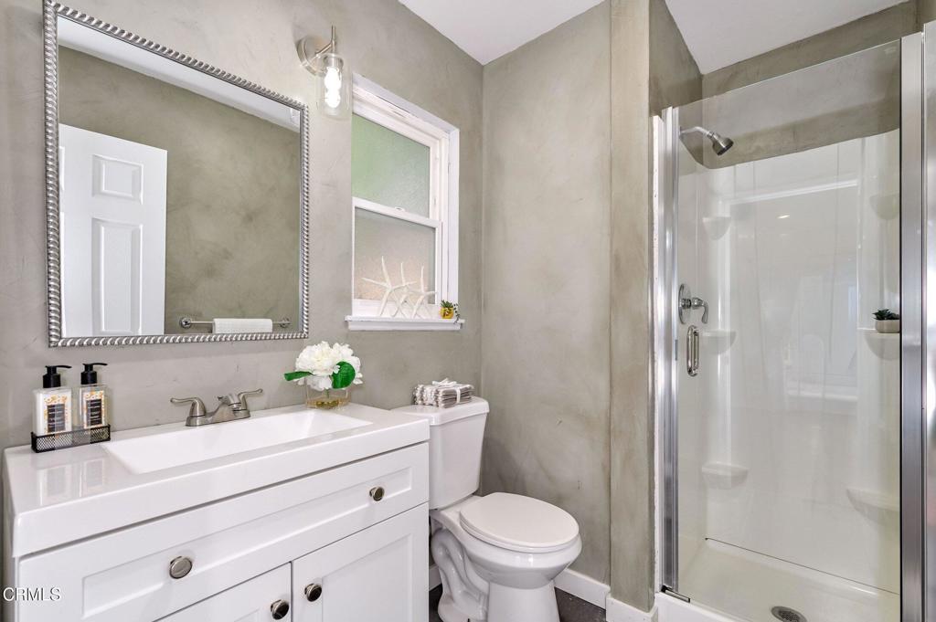4895 Muirwood Court Simi Valley, CA 93063 - Photo 31 of 45 a bathroom with a sink a toilet and shower