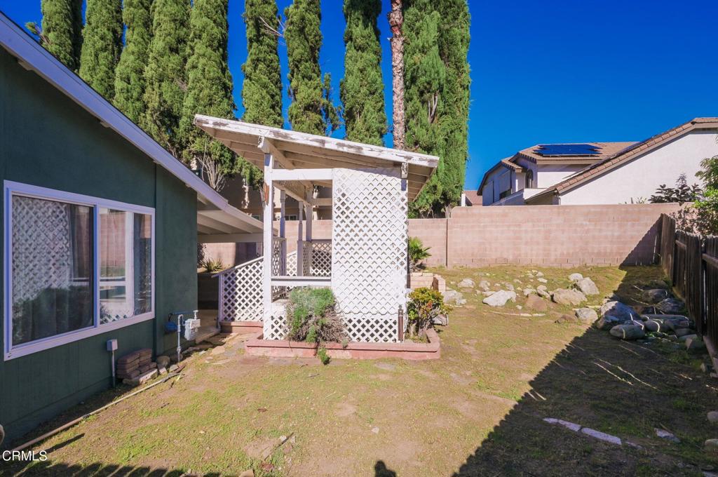 4895 Muirwood Court Simi Valley, CA 93063 - Photo 35 of 45 a view of a backyard with chairs
