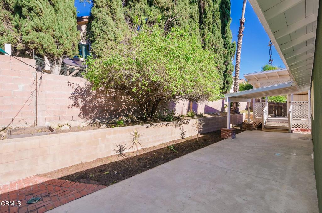 4895 Muirwood Court Simi Valley, CA 93063 - Photo 37 of 45 a view of a back yard of the house and a street view