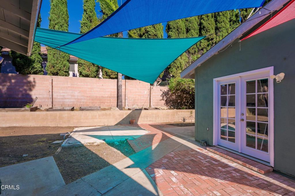 4895 Muirwood Court Simi Valley, CA 93063 - Photo 41 of 45 a view of a backyard with a tub and wooden fence