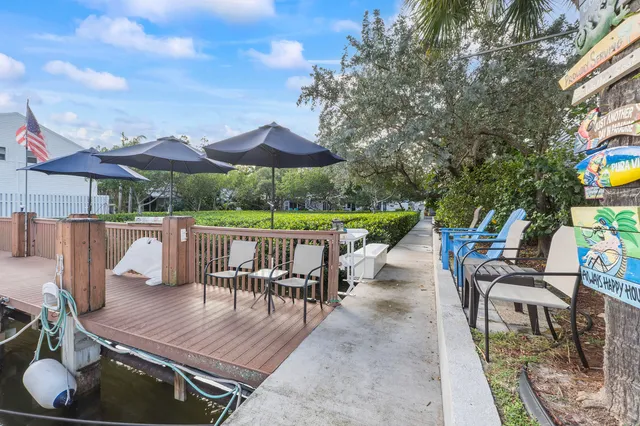 an outdoor space with furniture and umbrella