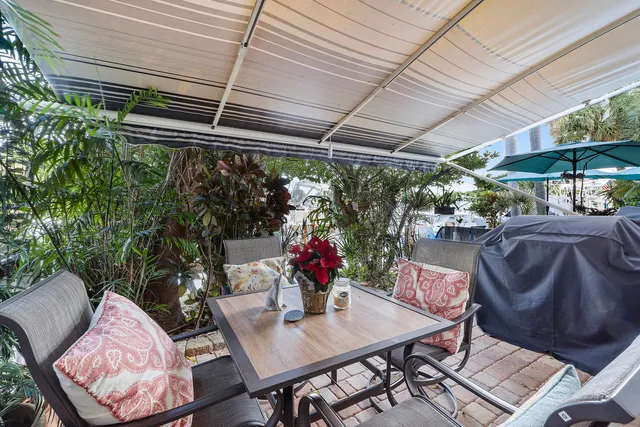 a view of a patio filled with furniture