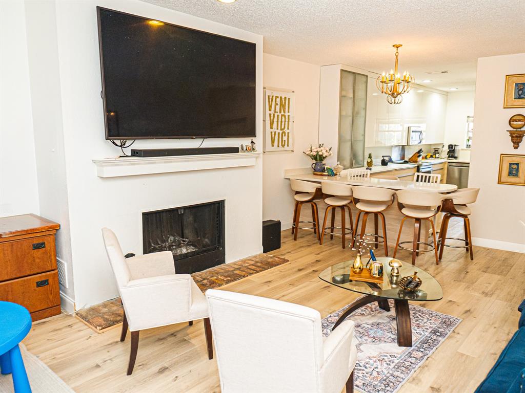 5310 Keller Springs Road, Unit 711 Dallas, TX 75248 - Photo 11 of 20 a living room with a flat screen tv and a table