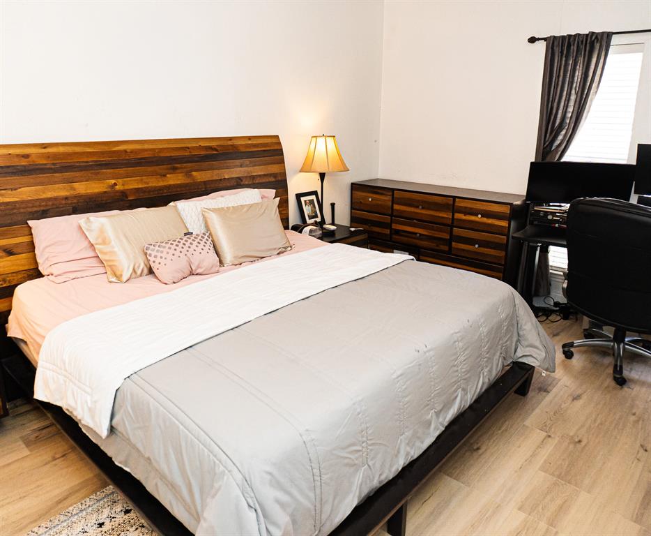 5310 Keller Springs Road, Unit 711 Dallas, TX 75248 - Photo 14 of 20 a bedroom with a bed and dresser