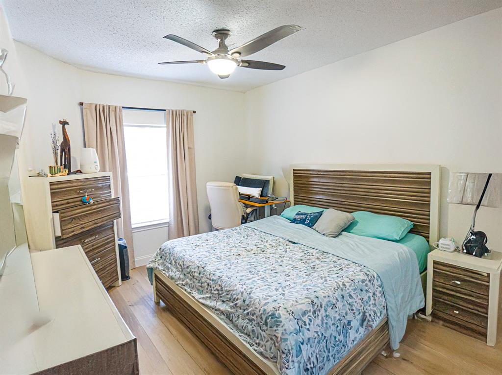 5310 Keller Springs Road, Unit 711 Dallas, TX 75248 - Photo 16 of 20 a bedroom with a bed and dresser