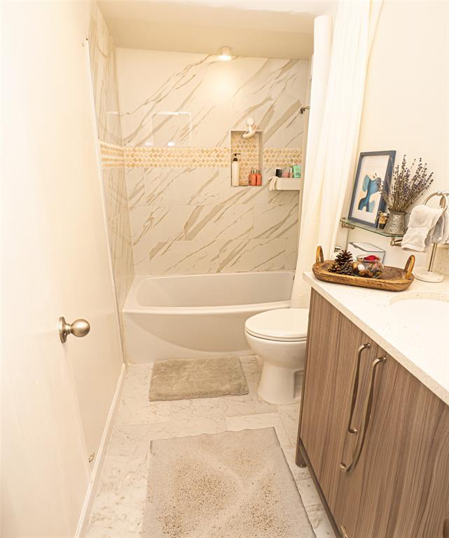 5310 Keller Springs Road, Unit 711 Dallas, TX 75248 - Photo 18 of 20 a bathroom with a sink toilet and shower