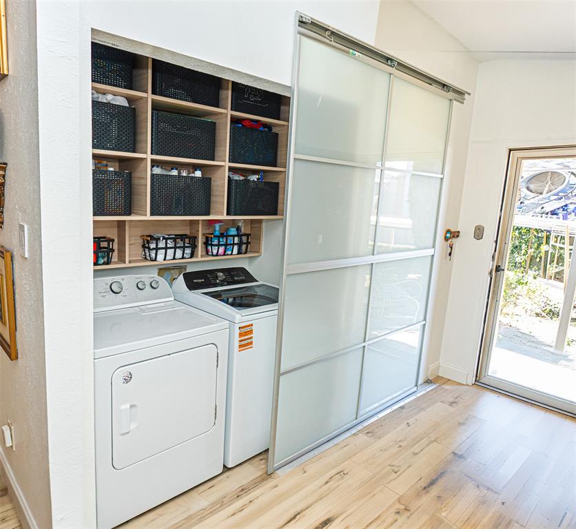 5310 Keller Springs Road, Unit 711 Dallas, TX 75248 - Photo 19 of 20 a view of storage and utility room with washer and dryer