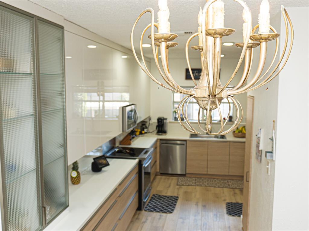 5310 Keller Springs Road, Unit 711 Dallas, TX 75248 - Photo 4 of 20 a view of a room with wooden floor and staircase