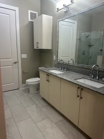 a bathroom with a bathtub and shower
