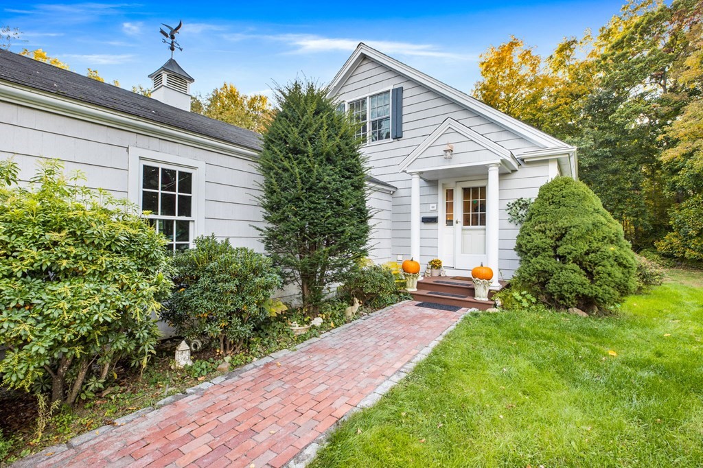 a front view of a house with garden