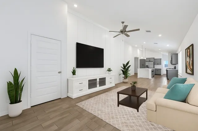 a living room with furniture and a flat screen tv