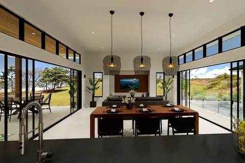 a view of living room with furniture and floor to ceiling windows