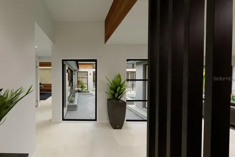 a view of a living room and entryway