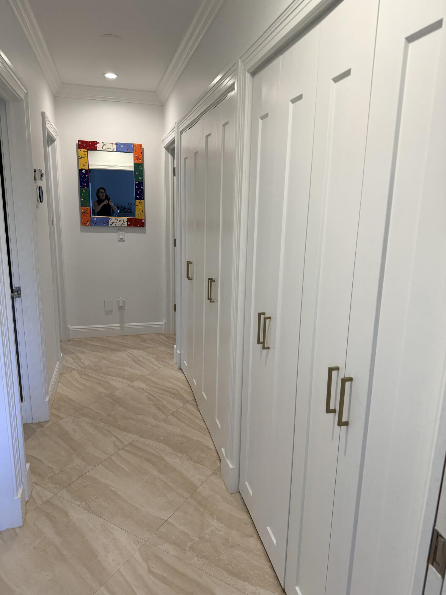13254 Polo Club Road, Unit C204 Wellington, FL 33414 - Photo 28 of 29 a view of a hallway with wooden floor and staircase