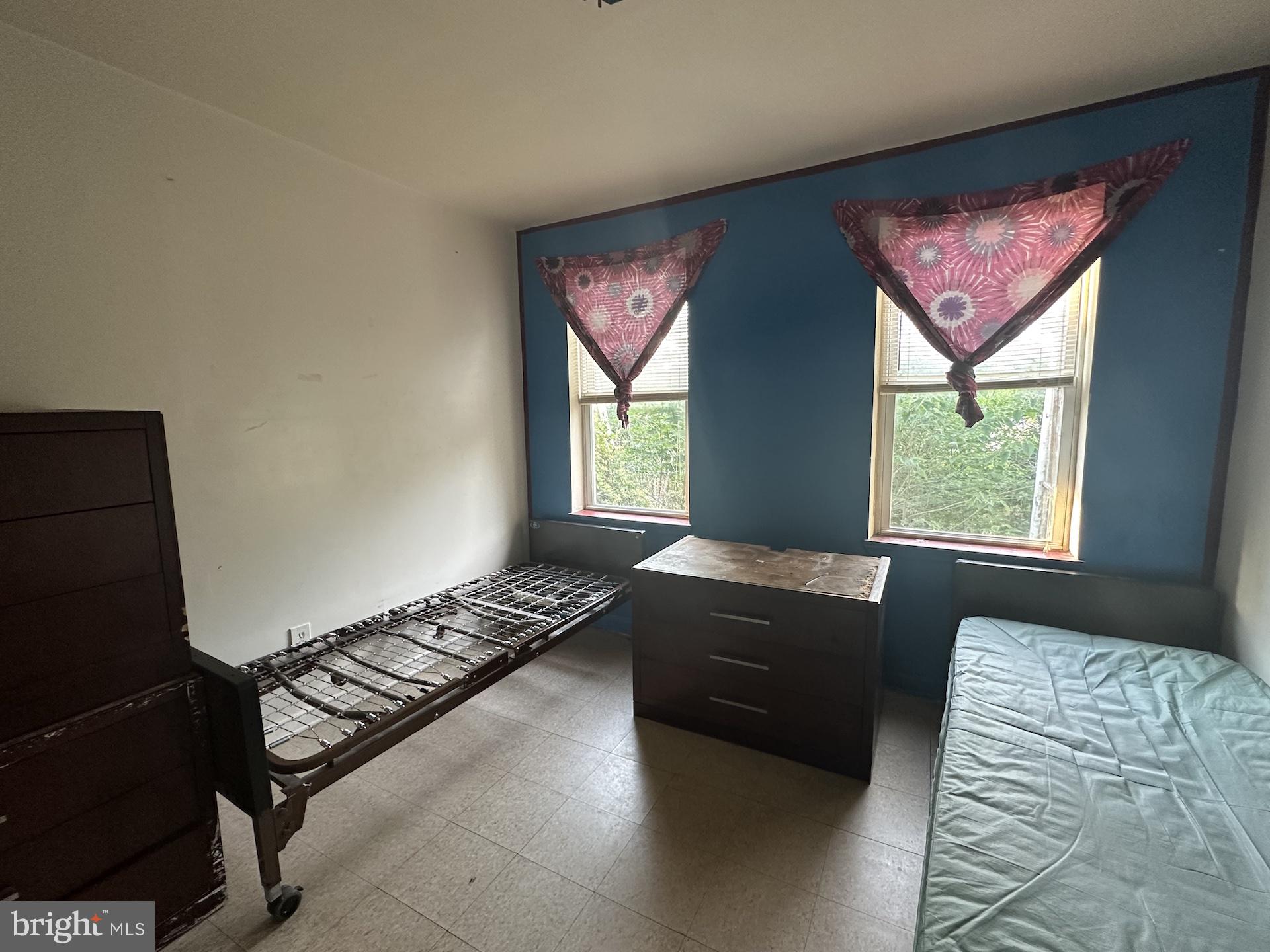 3926 Ridgewood Avenue Baltimore, MD 21215 - Photo 11 of 21 a bedroom with a bed and a window