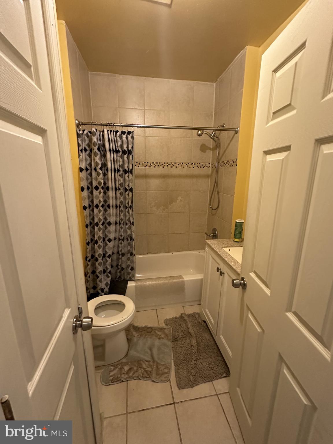 3926 Ridgewood Avenue Baltimore, MD 21215 - Photo 13 of 21 a bathroom with a toilet and a shower