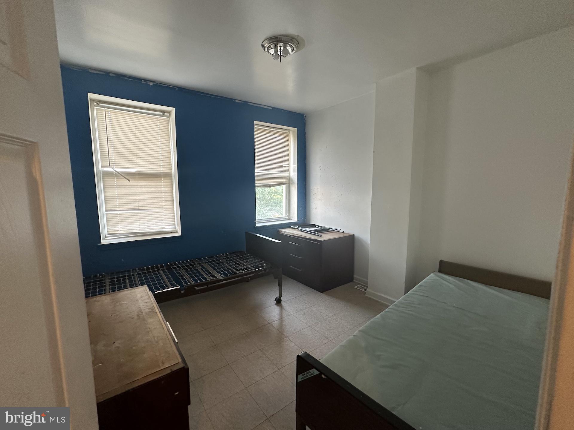 3926 Ridgewood Avenue Baltimore, MD 21215 - Photo 14 of 21 a living room with furniture and a window