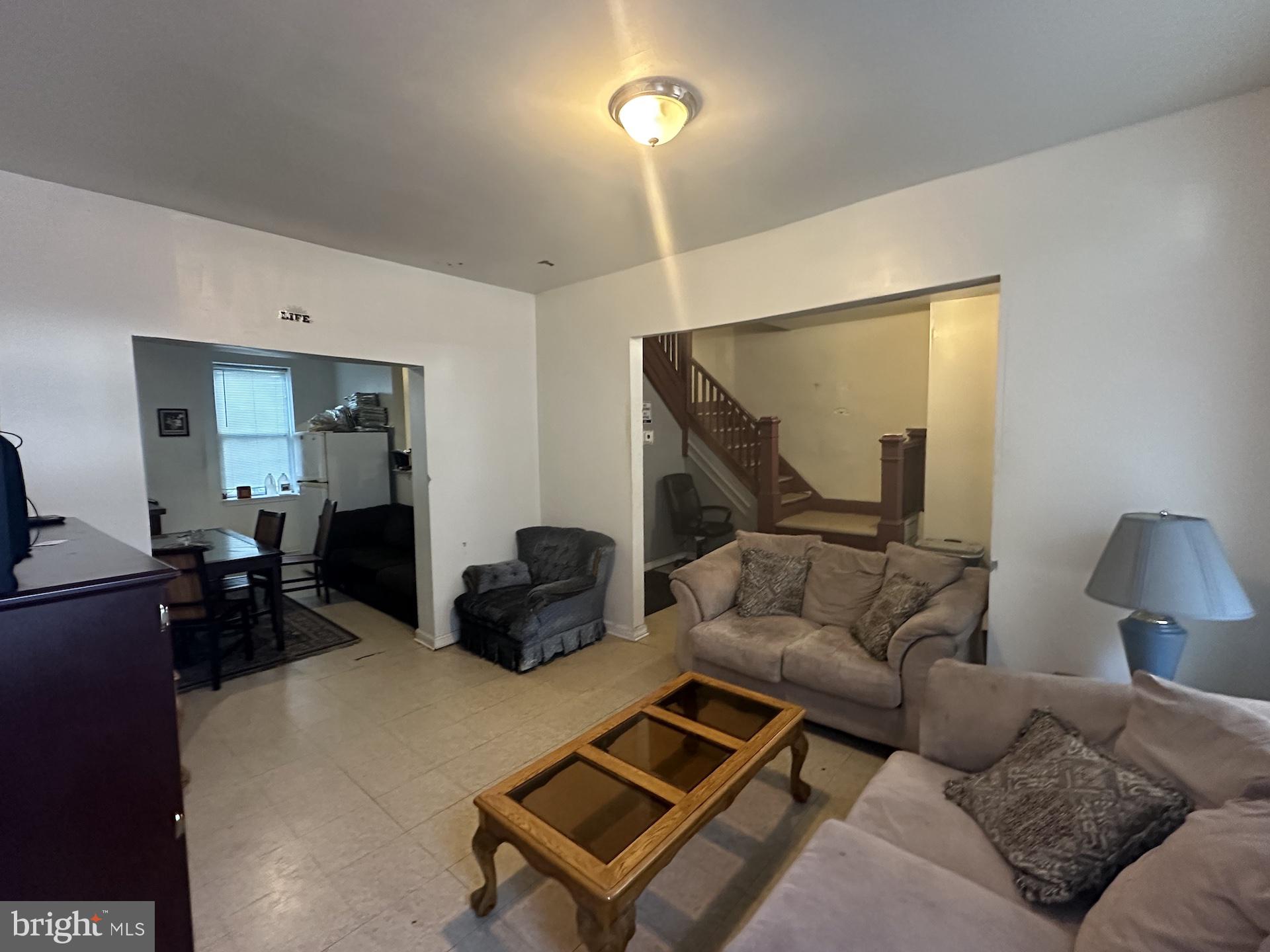 3926 Ridgewood Avenue Baltimore, MD 21215 - Photo 2 of 21 a living room with furniture and a lamp