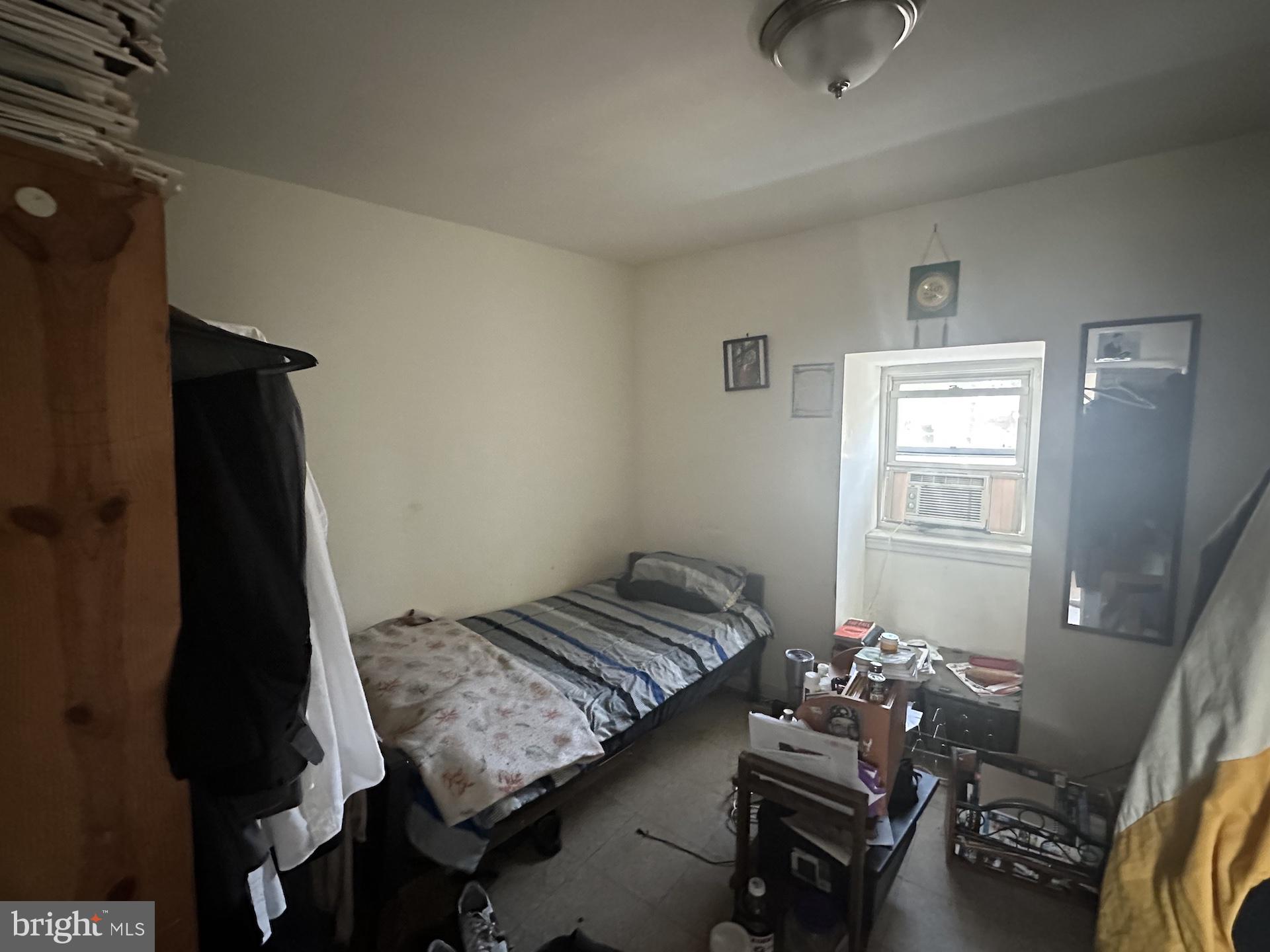 3926 Ridgewood Avenue Baltimore, MD 21215 - Photo 8 of 21 a bedroom with a bed and window
