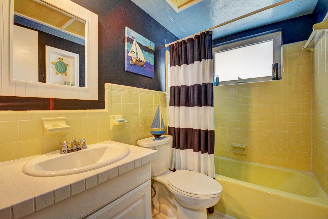 1135 Southwest 14th Street Boca Raton, FL 33486 - Photo 23 of 26 a bathroom with a sink toilet and shower