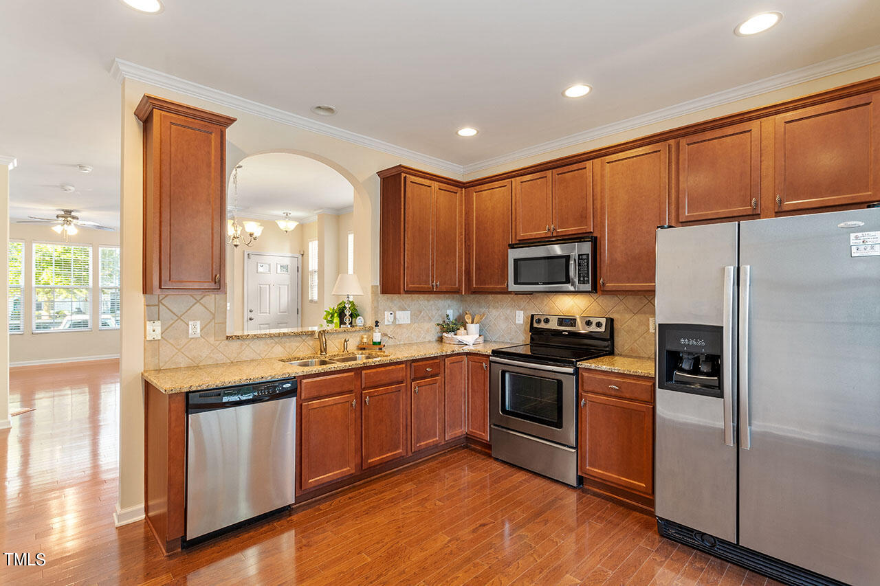 864 Cupola Drive Raleigh, NC 27603 - Photo 13 of 26 Work triangle. Regrigerator conveys.