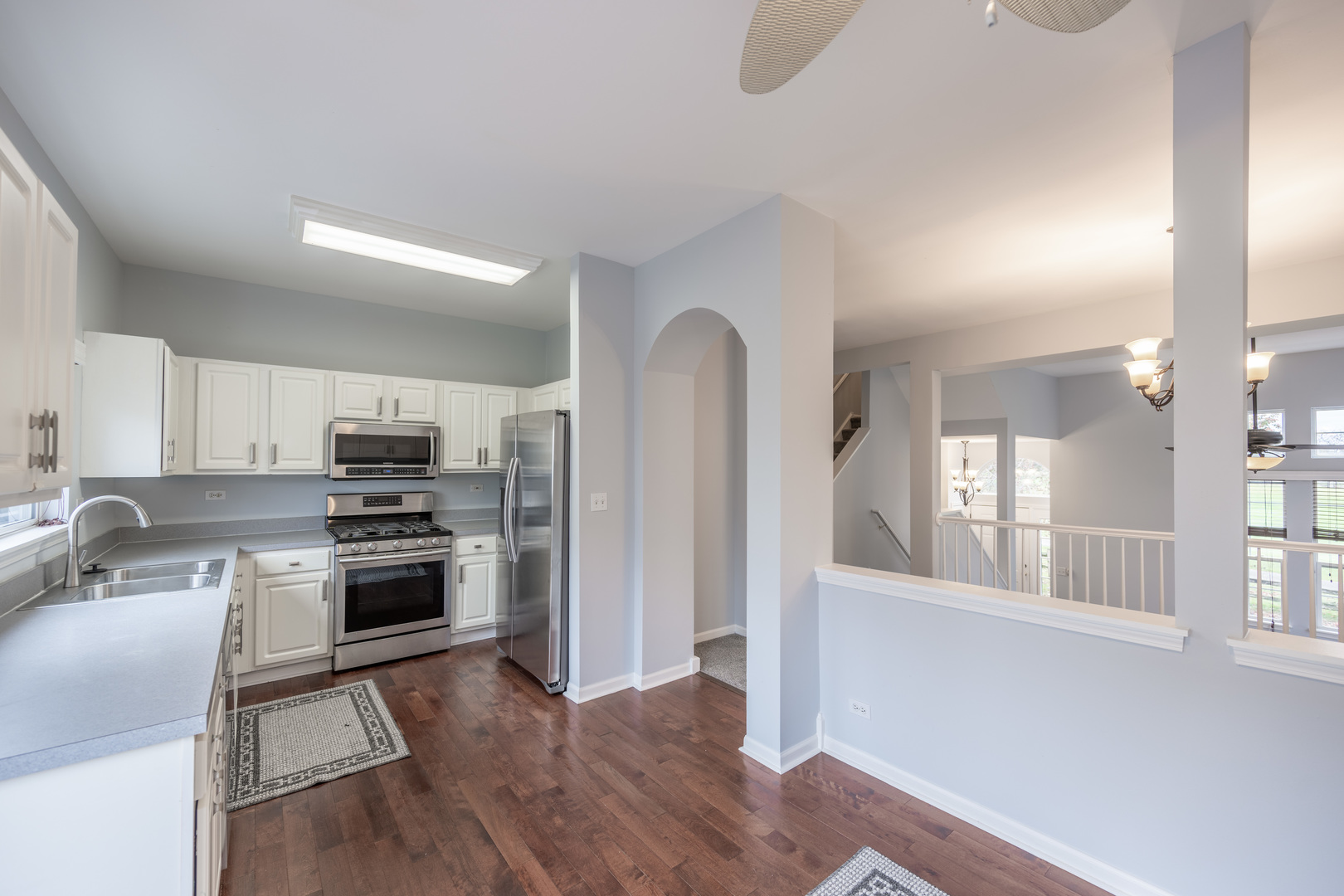 2430 Courtyard Circle, Unit 6 Aurora, IL 60506 - Photo 11 of 28 a kitchen with stainless steel appliances granite countertop a refrigerator a stove top oven a sink and dishwasher