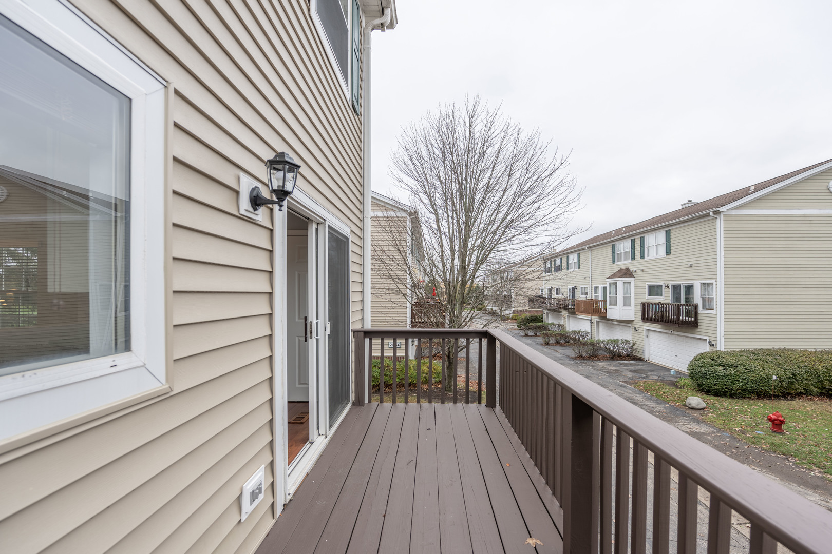 2430 Courtyard Circle, Unit 6 Aurora, IL 60506 - Photo 13 of 28 a view of a house with a deck