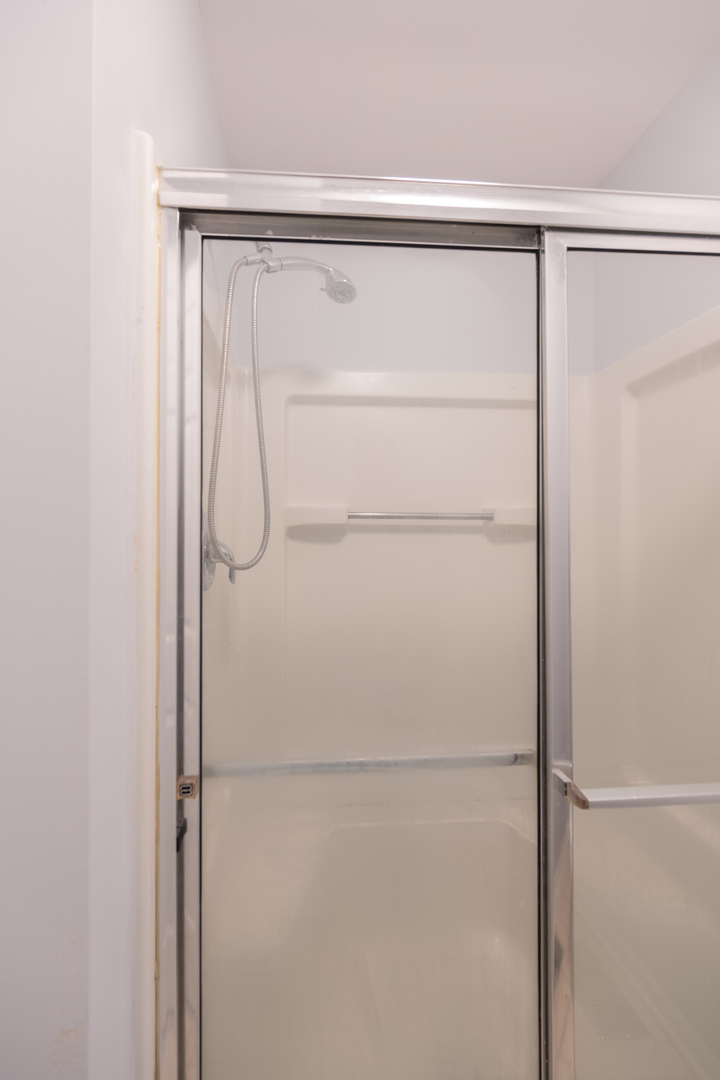 2430 Courtyard Circle, Unit 6 Aurora, IL 60506 - Photo 17 of 28 a bathroom with a shower